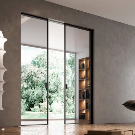 Flush-to-the-wall sliding doors inside the wall in glass and aluminum designed by Bertolotto